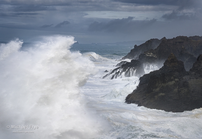 Waves crashing against a rocky shoreline, Oregon Coast, USA