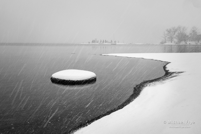 Rocks, shore, and pagoda in a snowstorm, Hokkaido, Japan