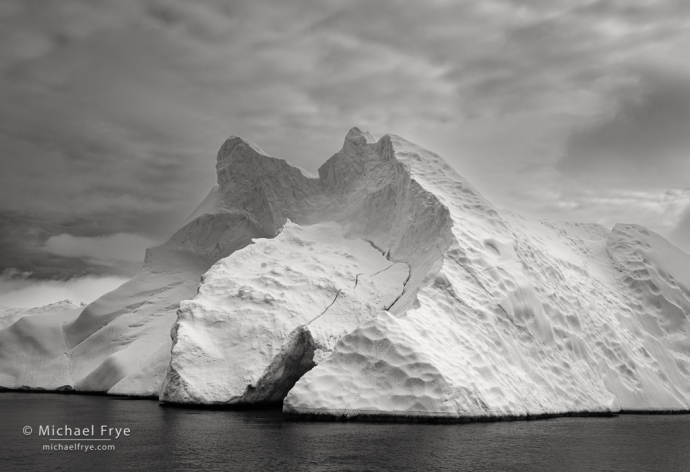 Iceberg and clouds, Antarctica